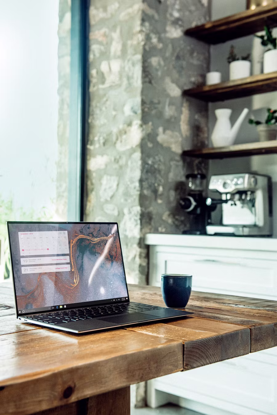 Laptop on a rustic wooden table — running the rate math yourself